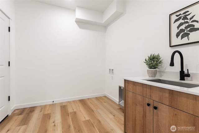 251 Sweet Gum Dr, Blaine, WA 98230 - laundry room with cabinet space, washer hookup, and light wood-type flooring
