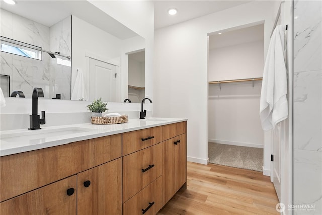 251 Sweet Gum Dr, Blaine, WA 98230 - bathroom featuring double vanity, a marble finish shower, wood finished floors, recessed lighting, and a spacious closet