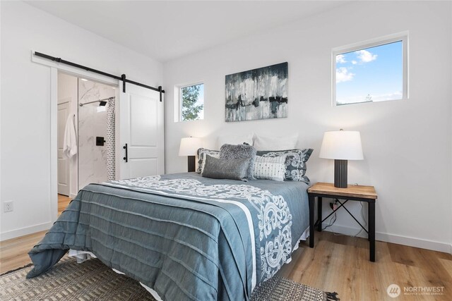 251 Sweet Gum Dr, Blaine, WA 98230 - bedroom with wood finished floors and a barn door