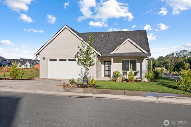 251 Sweet Gum Dr, Blaine, WA 98230 - view of front facade featuring driveway, an attached garage, a front lawn, and a shingled roof