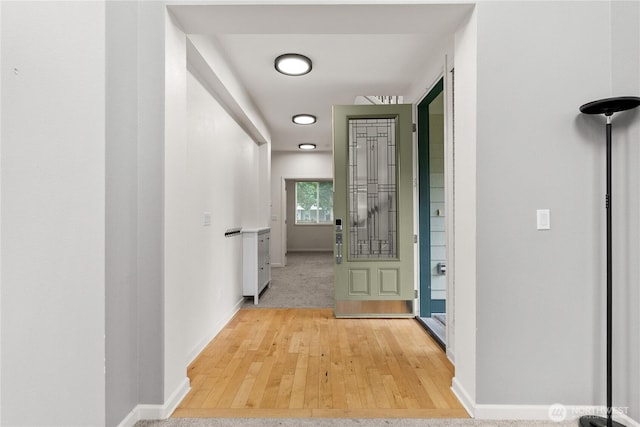 7701 Rushmore Ave NE, Lacey, WA 98516 - corridor featuring baseboards and light wood-type flooring