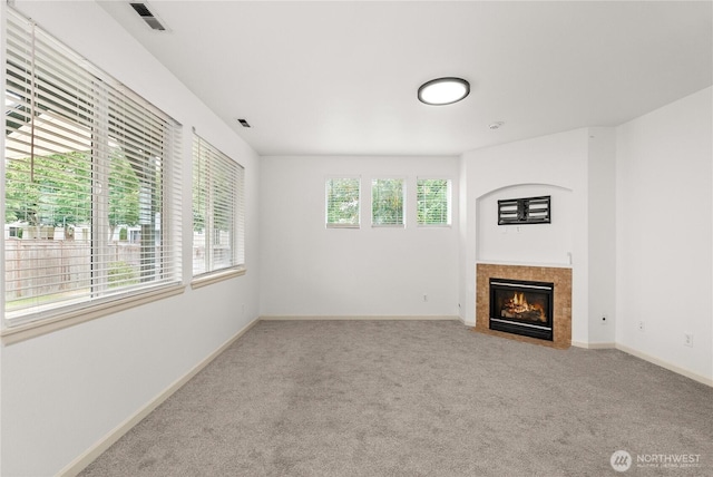 7701 Rushmore Ave NE, Lacey, WA 98516 - unfurnished living room featuring carpet flooring and a fireplace