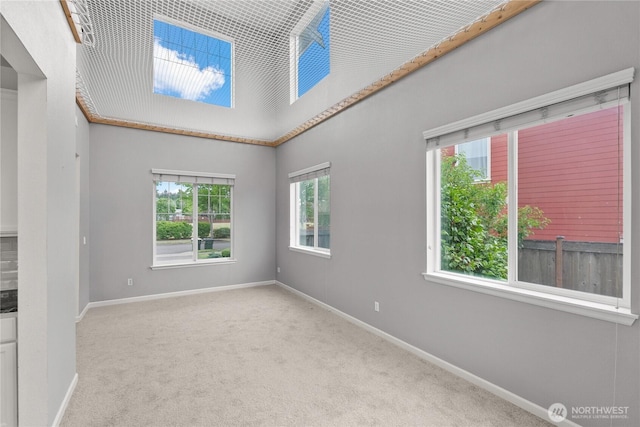 7701 Rushmore Ave NE, Lacey, WA 98516 - spare room featuring carpet floors and plenty of natural light