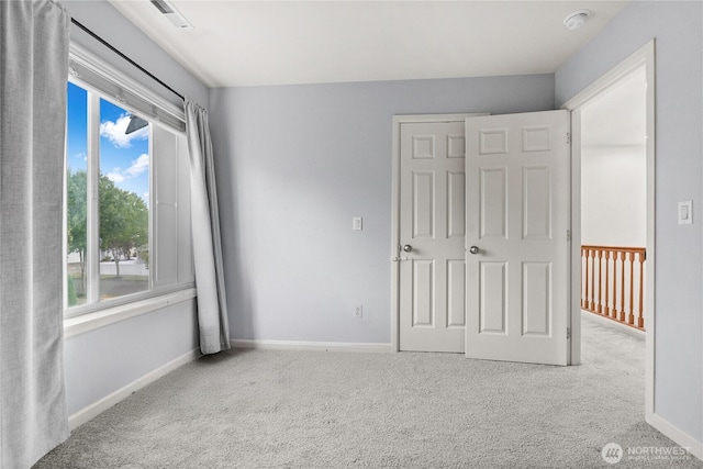 7701 Rushmore Ave NE, Lacey, WA 98516 - unfurnished bedroom featuring carpet flooring