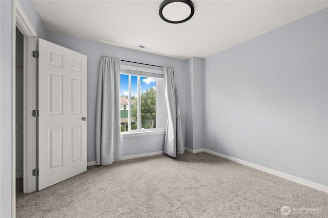 7701 Rushmore Ave NE, Lacey, WA 98516 - unfurnished bedroom featuring carpet flooring and baseboards