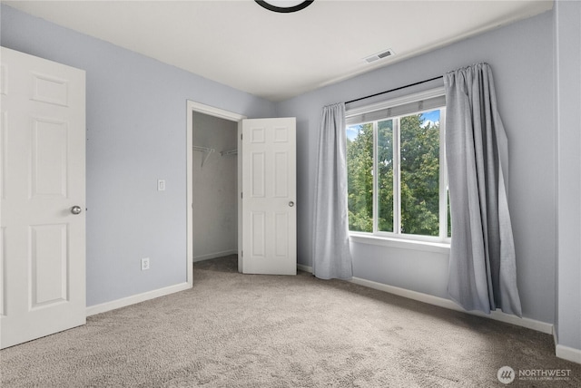 7701 Rushmore Ave NE, Lacey, WA 98516 - unfurnished bedroom featuring carpet and a spacious closet