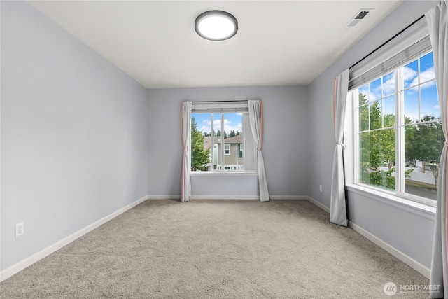 7701 Rushmore Ave NE, Lacey, WA 98516 - carpeted empty room featuring healthy amount of natural light
