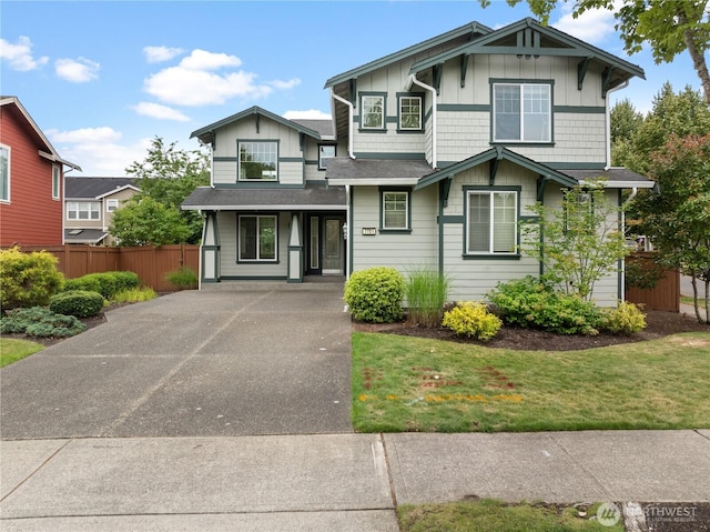7701 Rushmore Ave NE, Lacey, WA 98516 - view of front of house with board and batten siding and asphalt driveway