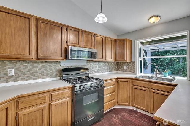 25128 168th Pl SE, Covington, WA 98042 - kitchen featuring gas stove, stainless steel microwave, vaulted ceiling, and light countertops
