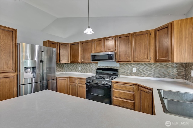25128 168th Pl SE, Covington, WA 98042 - kitchen with appliances with stainless steel finishes, lofted ceiling, decorative backsplash, light countertops, and brown cabinetry