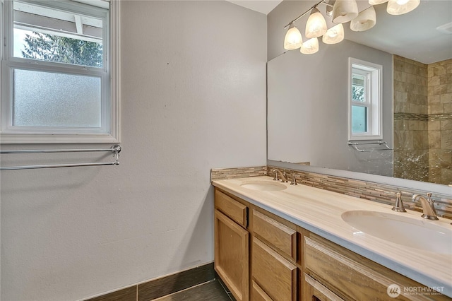 25128 168th Pl SE, Covington, WA 98042 - bathroom featuring double vanity, healthy amount of natural light, and backsplash