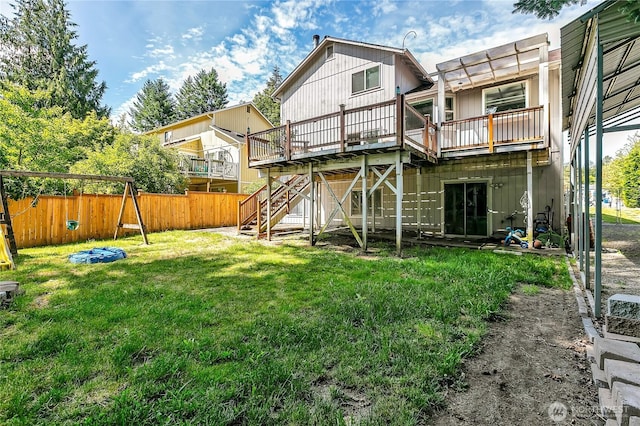 25128 168th Pl SE, Covington, WA 98042 - rear view of house featuring a wooden deck, stairs, and a playground