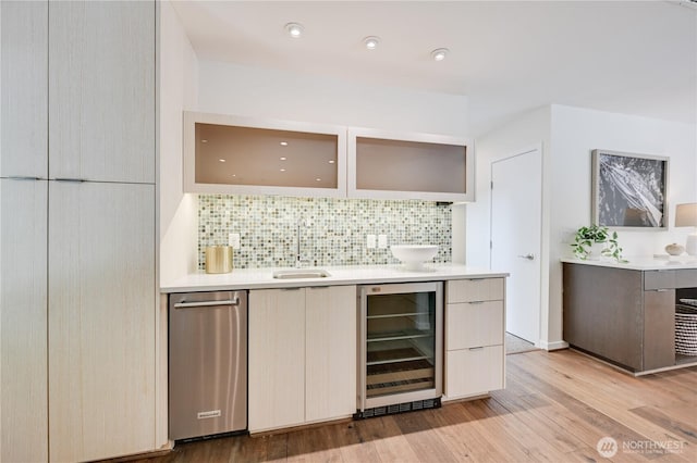 804 109th Ave SE, Bellevue, WA 98004 - indoor wet bar with beverage cooler, tasteful backsplash, and light wood-type flooring