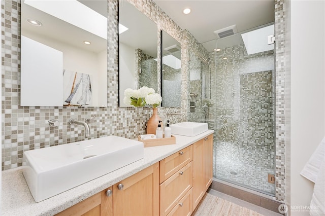 804 109th Ave SE, Bellevue, WA 98004 - bathroom with a stall shower, double vanity, tile walls, and recessed lighting