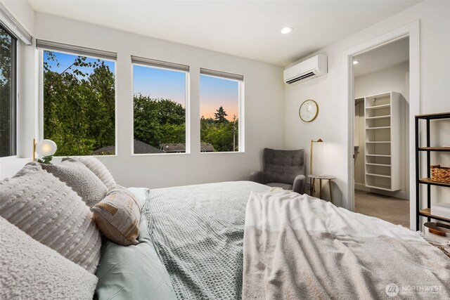 5404 26th Ave SW, Seattle, WA 98106 - carpeted bedroom featuring a wall unit AC, recessed lighting, and a spacious closet