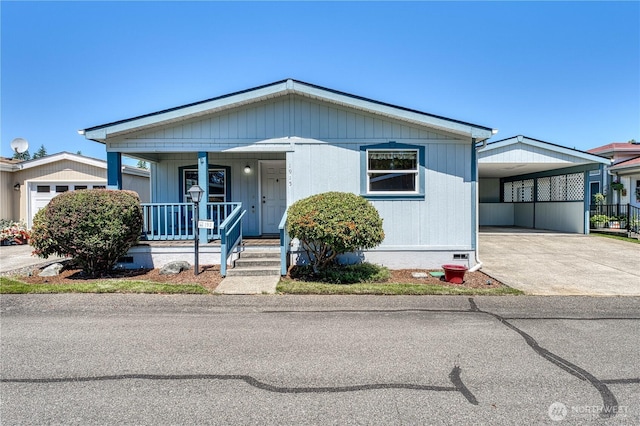 1915 140th St E Unit 193, Tacoma, WA 98445 - view of front of property with a porch, crawl space, and driveway