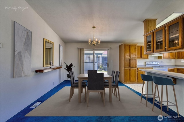 1915 140th St E Unit 193, Tacoma, WA 98445 - carpeted dining area featuring a chandelier