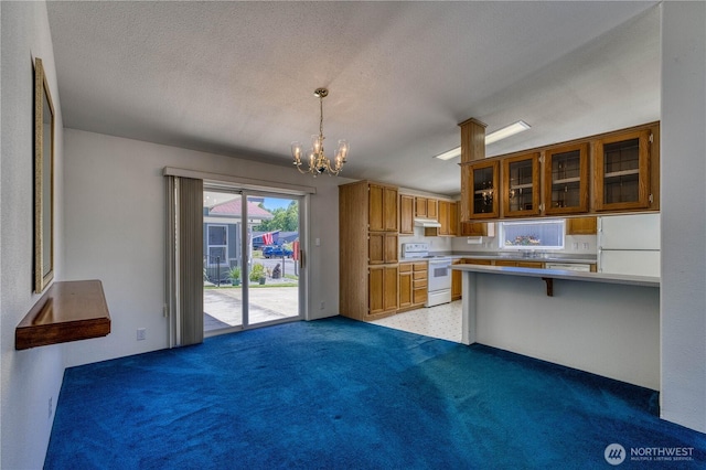 1915 140th St E Unit 193, Tacoma, WA 98445 - kitchen featuring white appliances, brown cabinetry, a chandelier, glass insert cabinets, and light carpet