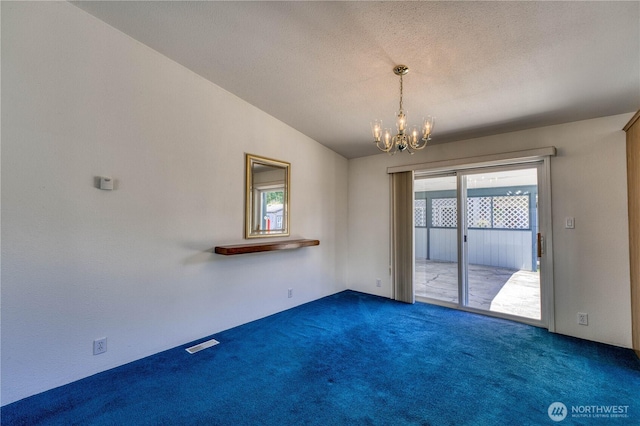 1915 140th St E Unit 193, Tacoma, WA 98445 - carpeted empty room with a chandelier and a textured ceiling