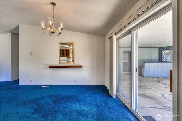 1915 140th St E Unit 193, Tacoma, WA 98445 - unfurnished dining area featuring carpet, vaulted ceiling, and a chandelier