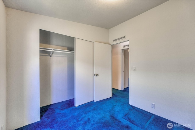 1915 140th St E Unit 193, Tacoma, WA 98445 - unfurnished bedroom featuring dark carpet and a closet
