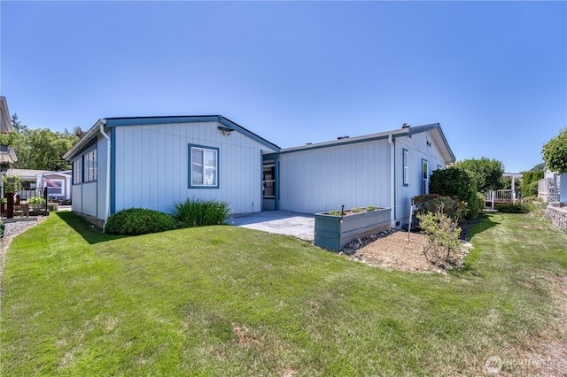 1915 140th St E Unit 193, Tacoma, WA 98445 - rear view of property with a yard