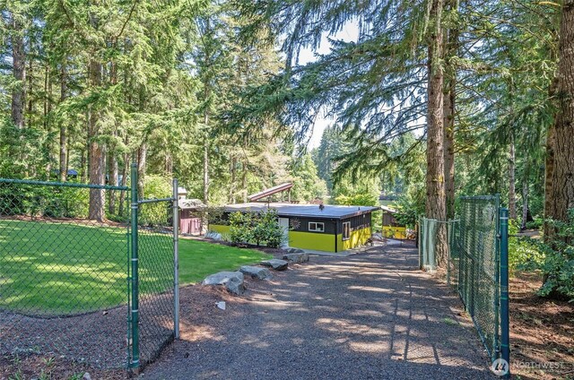 13285 Wye Lake Blvd SW, Port Orchard, WA 98367 - surrounding community featuring a view of trees and a gate