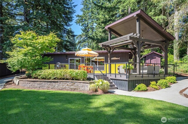 13285 Wye Lake Blvd SW, Port Orchard, WA 98367 - view of property's community with a deck, a storage unit, and stairway