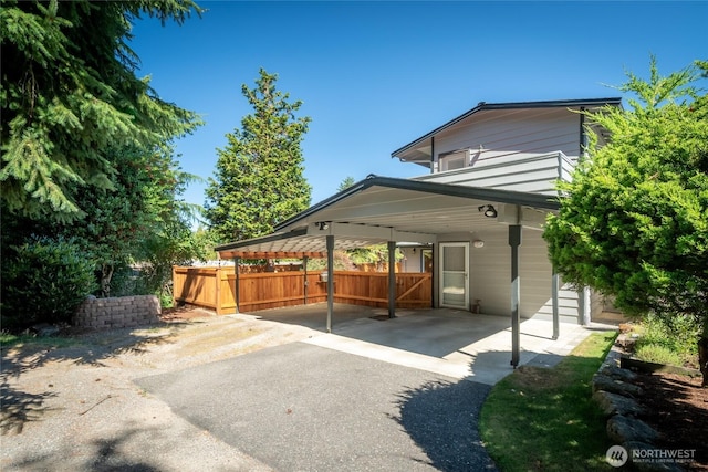 11627 NE 75th St, Kirkland, WA 98033 - rear view of property featuring asphalt driveway and an attached carport