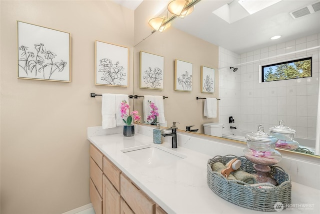 11627 NE 75th St, Kirkland, WA 98033 - full bath featuring vanity, a skylight, and shower / washtub combination