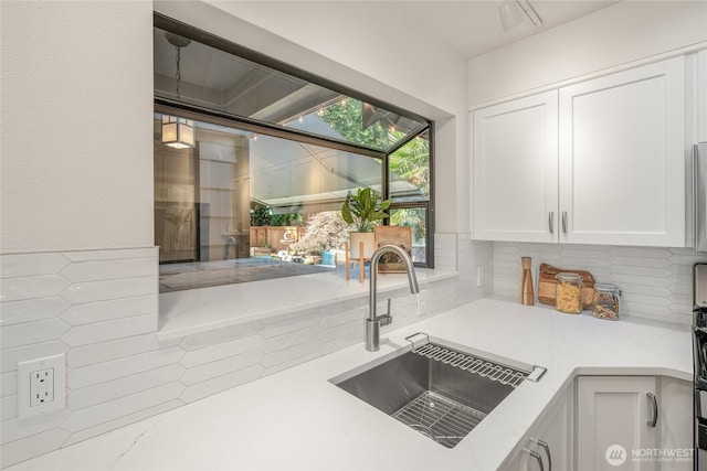 11627 NE 75th St, Kirkland, WA 98033 - kitchen featuring white cabinetry, light countertops, and tasteful backsplash
