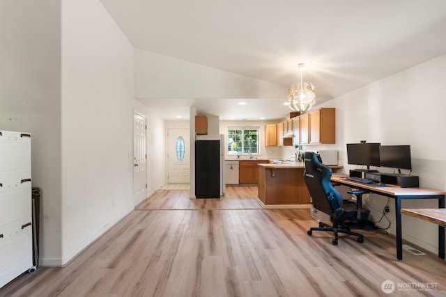405 Spring Ln, Sedro Woolley, WA 98284 - office featuring stacked washer / drying machine, light wood-type flooring, vaulted ceiling, and a chandelier