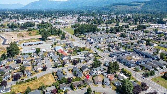 405 Spring Ln, Sedro Woolley, WA 98284 - aerial view of property and surrounding area with mountains and nearby suburban area
