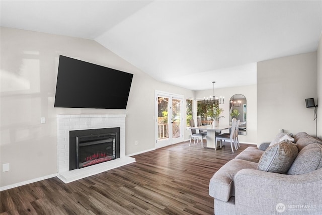 1617 SW 324th Pl, Federal Way, WA 98023 - living area with a chandelier, dark wood-style flooring, a fireplace, and vaulted ceiling