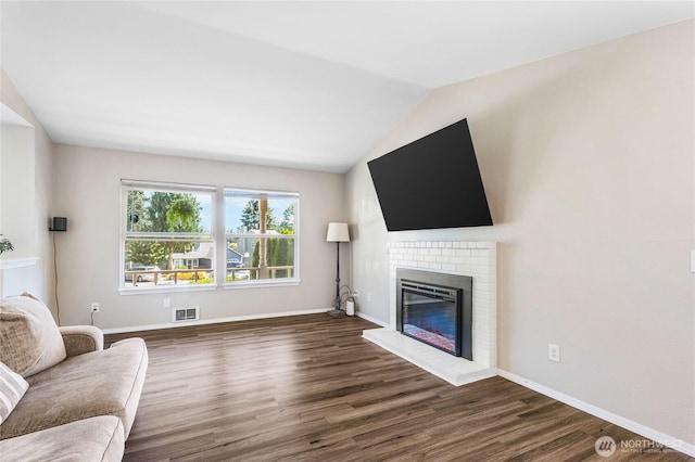 1617 SW 324th Pl, Federal Way, WA 98023 - living area featuring dark wood-type flooring, a fireplace, and vaulted ceiling