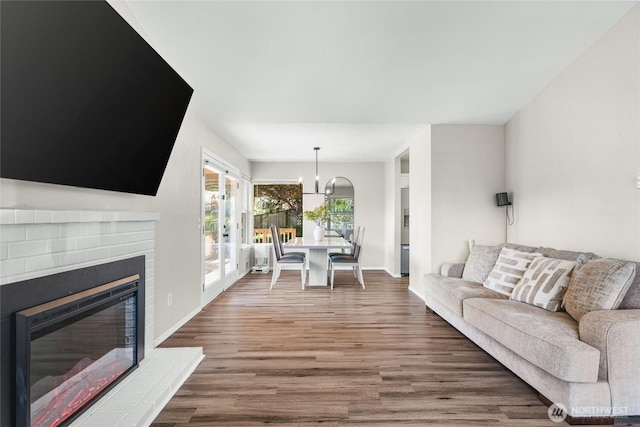 1617 SW 324th Pl, Federal Way, WA 98023 - living room featuring wood finished floors, a chandelier, and a fireplace