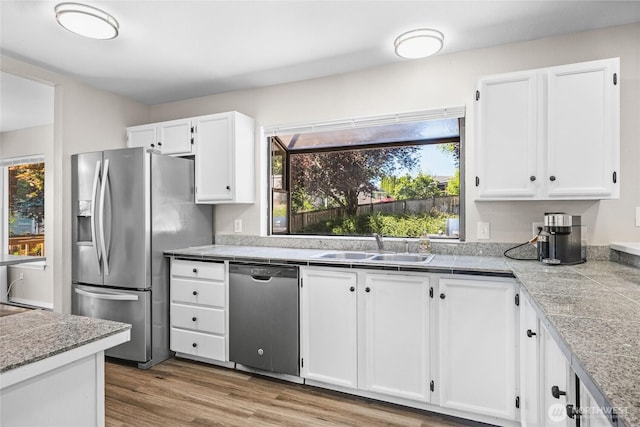 1617 SW 324th Pl, Federal Way, WA 98023 - kitchen featuring stainless steel appliances, white cabinets, tile countertops, and wood finished floors