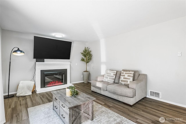 1617 SW 324th Pl, Federal Way, WA 98023 - living area featuring wood finished floors and a glass covered fireplace
