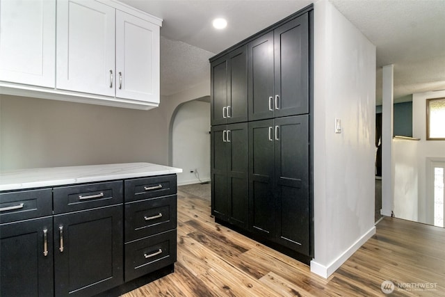 416 142nd Street Ct S, Tacoma, WA 98444 - hall featuring arched walkways, light wood finished floors, and recessed lighting