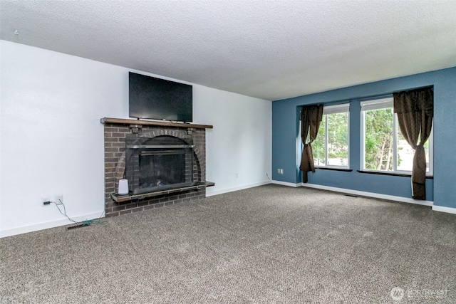416 142nd Street Ct S, Tacoma, WA 98444 - unfurnished living room featuring a textured ceiling, carpet, and a brick fireplace