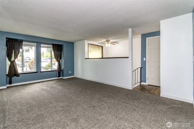 416 142nd Street Ct S, Tacoma, WA 98444 - empty room with dark carpet, a textured ceiling, and a ceiling fan