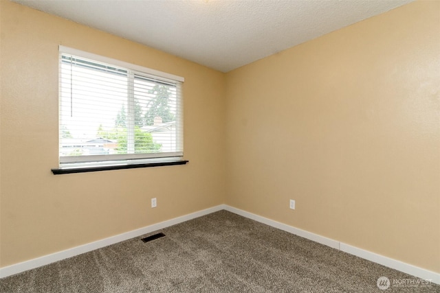 416 142nd Street Ct S, Tacoma, WA 98444 - empty room featuring dark colored carpet and baseboards