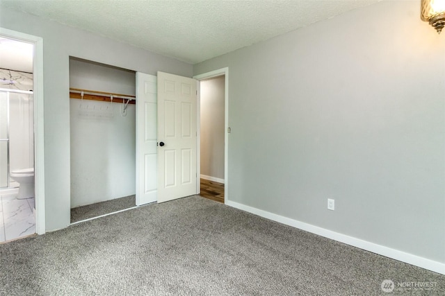 416 142nd Street Ct S, Tacoma, WA 98444 - unfurnished bedroom featuring carpet flooring, a closet, a textured ceiling, and ensuite bath