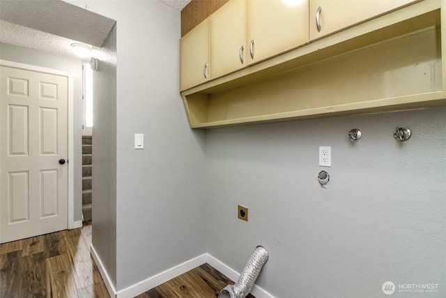 416 142nd Street Ct S, Tacoma, WA 98444 - laundry area featuring gas dryer hookup, hookup for an electric dryer, cabinet space, and dark wood-type flooring