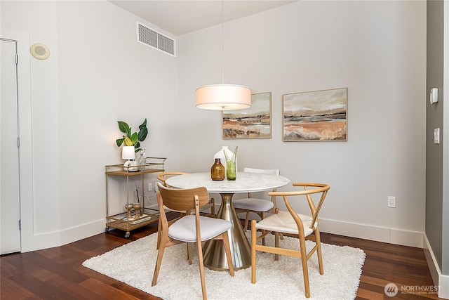 2121 Terry Ave Unit 1402, Seattle, WA 98121 - dining room with wood finished floors