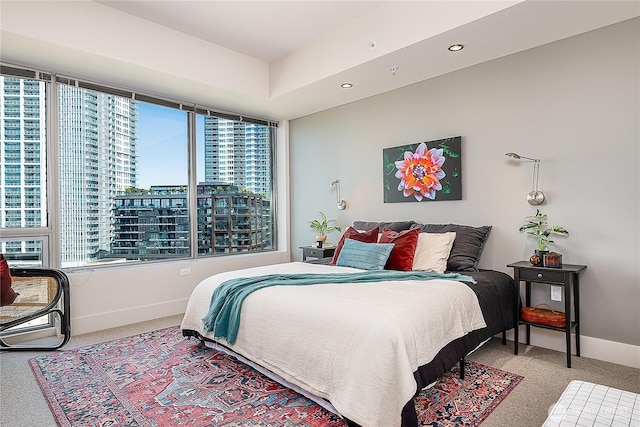 2121 Terry Ave Unit 1402, Seattle, WA 98121 - bedroom with carpet flooring, a city view, and recessed lighting