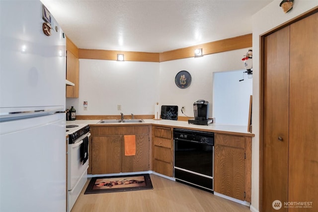 19524 Echo Lake Pl N Unit A-402, Shoreline, WA 98133 - kitchen with white appliances, light wood-style flooring, brown cabinets, and light countertops