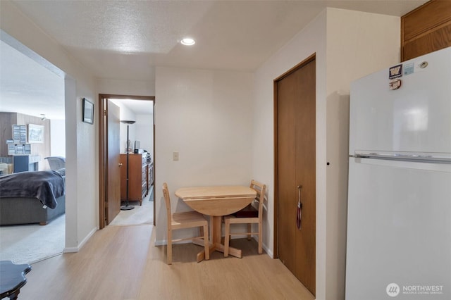 19524 Echo Lake Pl N Unit A-402, Shoreline, WA 98133 - dining area featuring light wood-style floors and recessed lighting