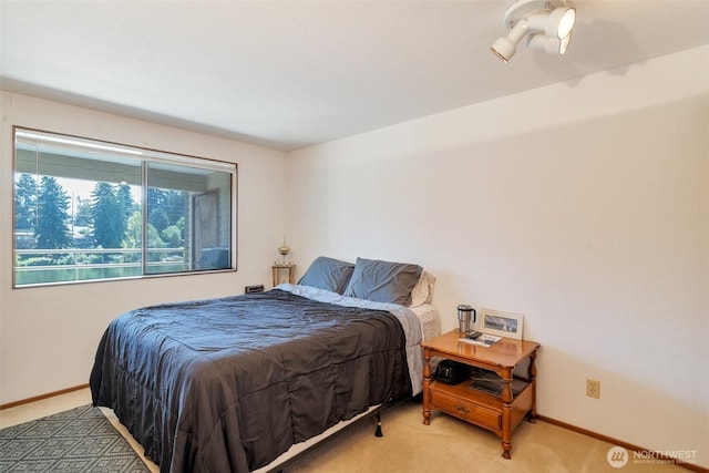 19524 Echo Lake Pl N Unit A-402, Shoreline, WA 98133 - bedroom featuring light carpet and baseboards