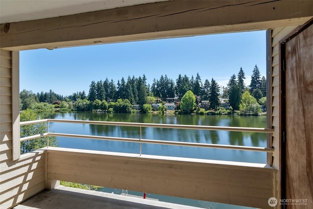 19524 Echo Lake Pl N Unit A-402, Shoreline, WA 98133 - balcony with a water view and view of wooded area